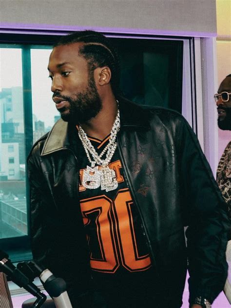 Meek Mill was sporting a pricey Louis Vuitton jacket at the Nets 